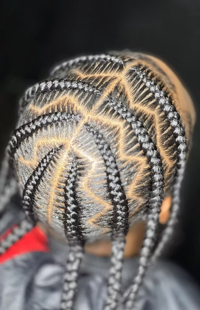 Detailed feed-in cornrows with zigzag parting at a North Austin braiding salon